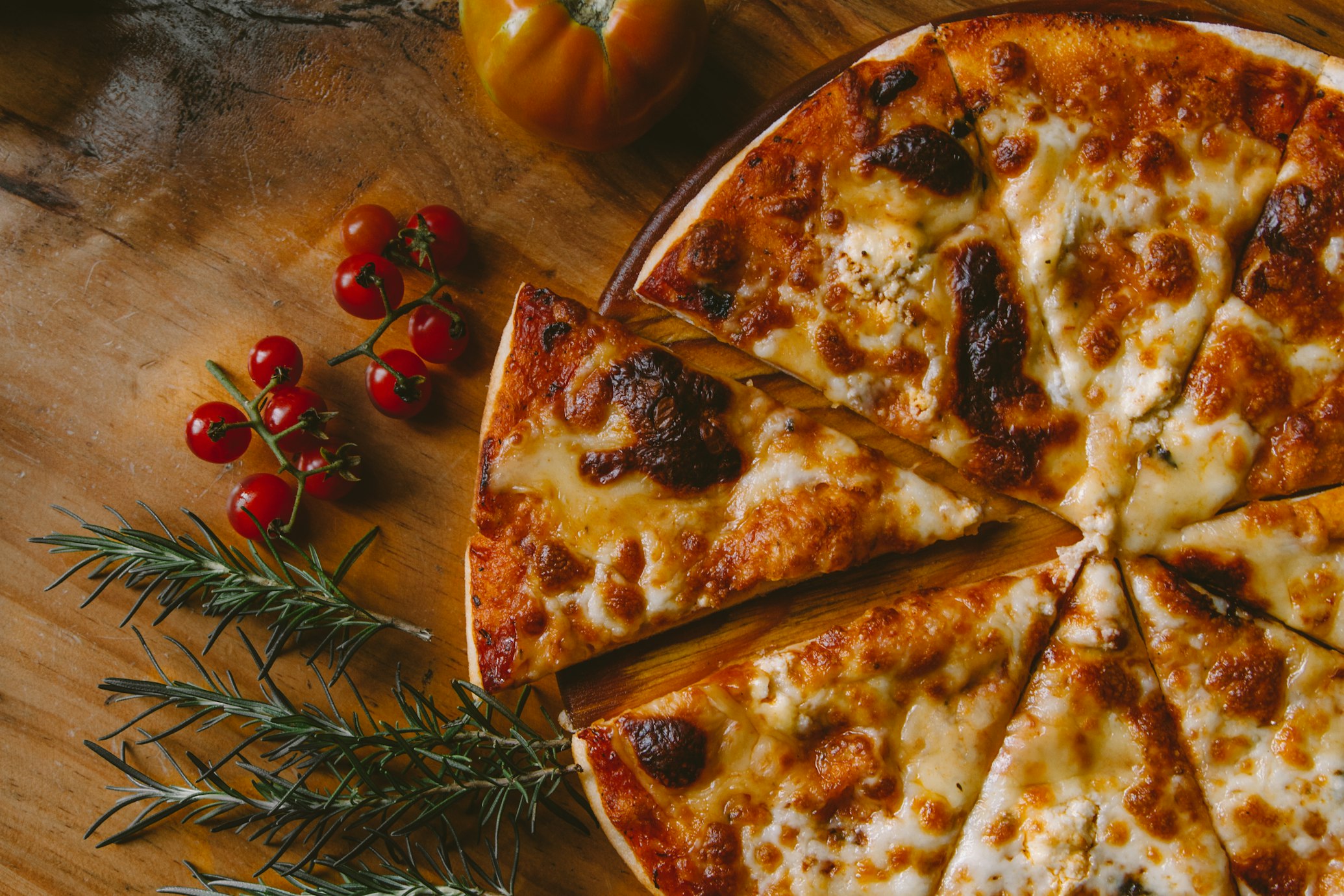 A delicious pizza on a wooden board